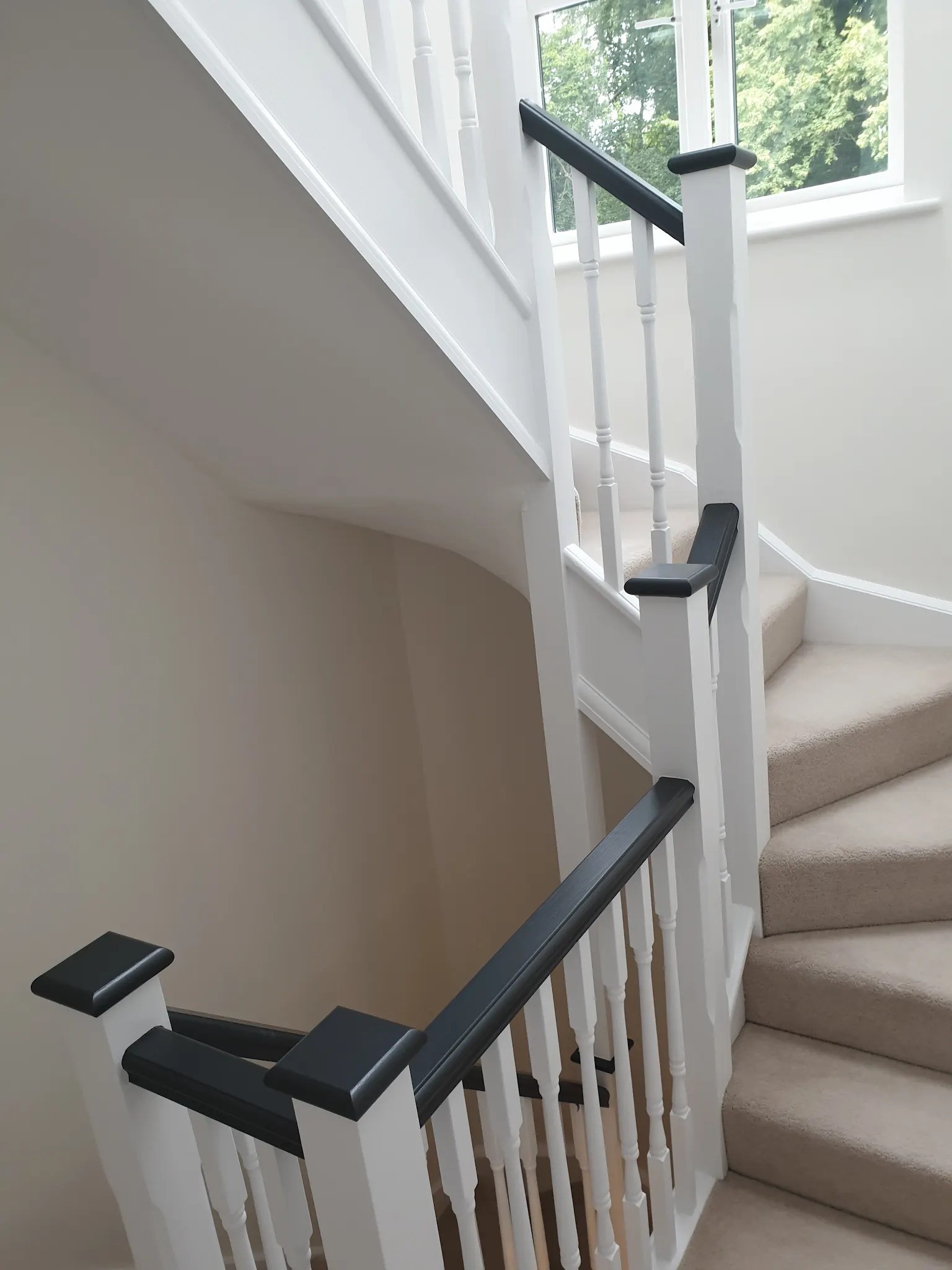 Staircase fully finished in white and black bannister