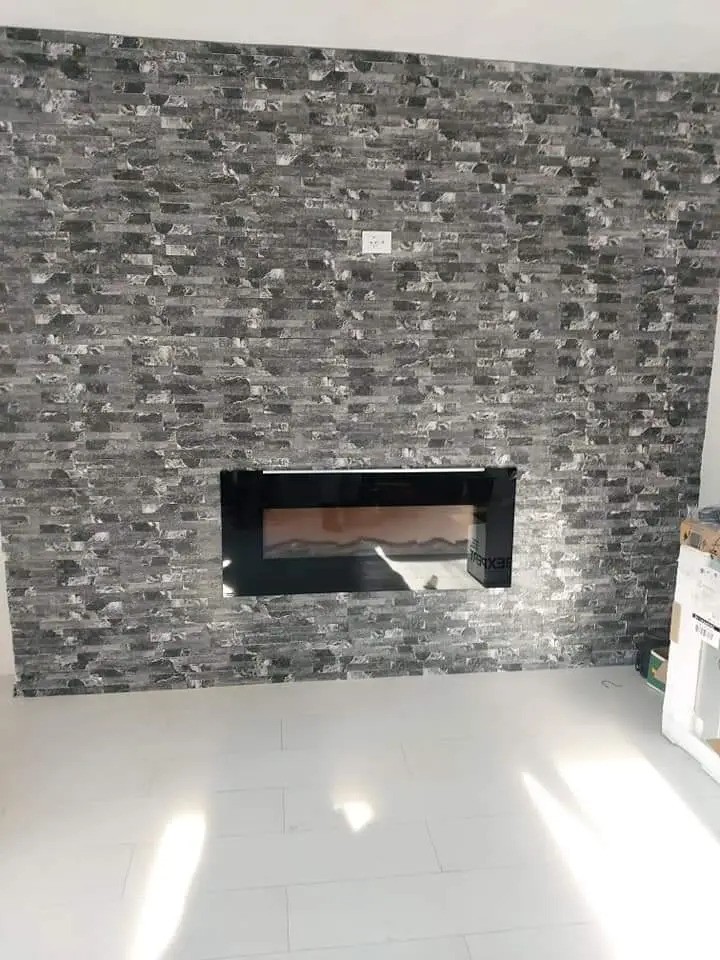 Tiles on the walls and electric fireplace fitted